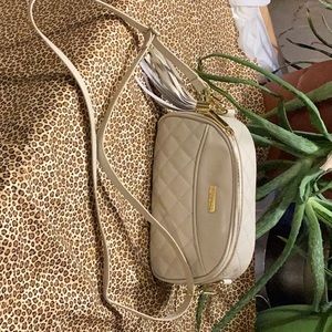 Like new Joy Imani bag trimmed in gold plated zipper attachments and shoulder.